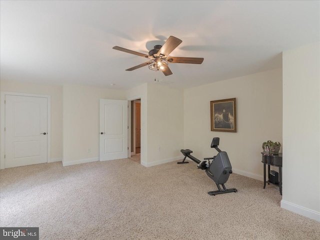 workout room featuring carpet floors, baseboards, and a ceiling fan
