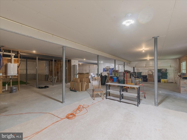 unfinished below grade area featuring water heater