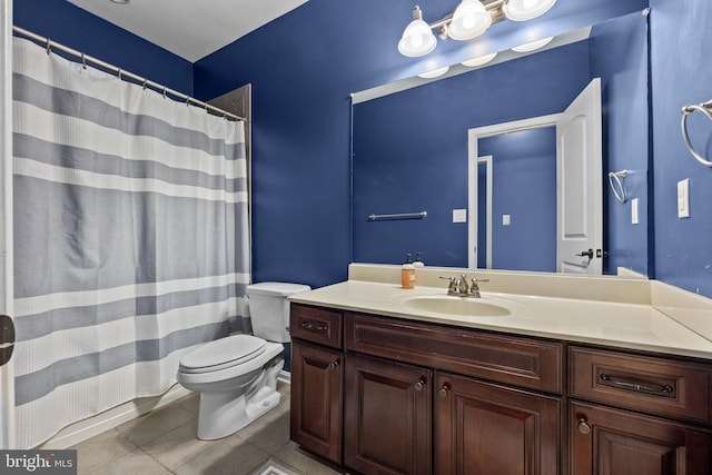 full bathroom featuring toilet, tile patterned flooring, and vanity