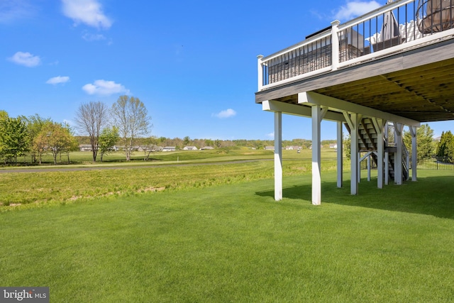 view of yard featuring stairs and a deck