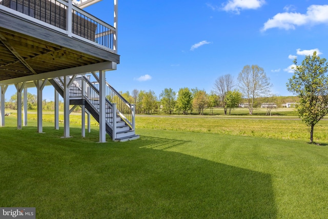 view of yard with stairway and a wooden deck
