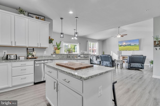 9937 Sodus Ct, Faulkner, MD 20632 - kitchen with a center island, dishwasher, open floor plan, white cabinets, and light wood-type flooring