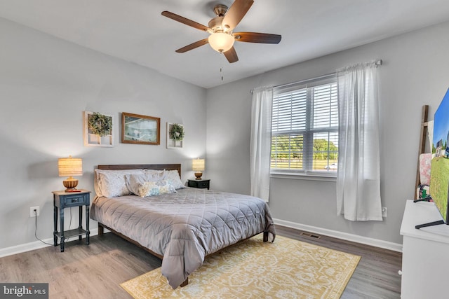 9937 Sodus Ct, Faulkner, MD 20632 - bedroom with baseboards, ceiling fan, visible vents, and wood finished floors