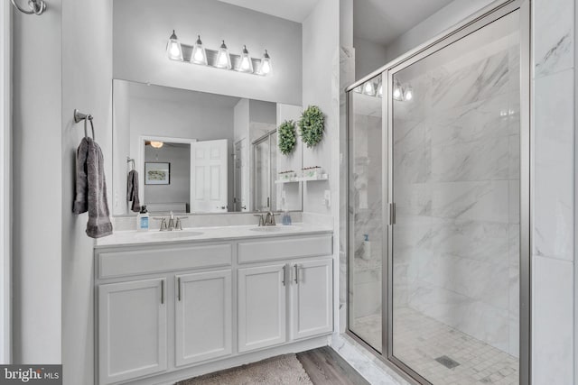 9937 Sodus Ct, Faulkner, MD 20632 - full bathroom featuring a shower stall, double vanity, and a sink