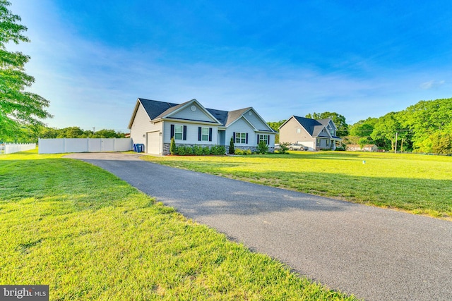 9937 Sodus Ct, Faulkner, MD 20632 - ranch-style home featuring an attached garage, driveway, fence, and a front yard