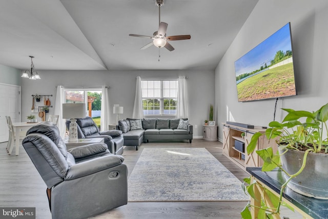 9937 Sodus Ct, Faulkner, MD 20632 - living room featuring baseboards, wood finished floors, and ceiling fan with notable chandelier