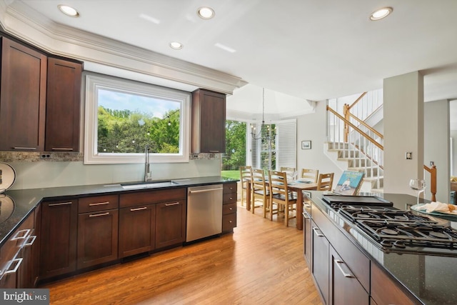 14309 Cervantes Ave, Darnestown, MD 20874 - kitchen with a sink, light wood-style floors, black gas cooktop, dark stone countertops, and stainless steel dishwasher