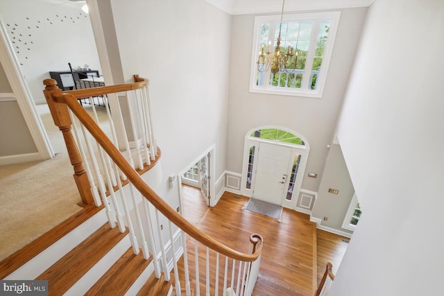 14309 Cervantes Ave, Darnestown, MD 20874 - foyer entrance featuring baseboards, a high ceiling, a notable chandelier, and wood finished floors
