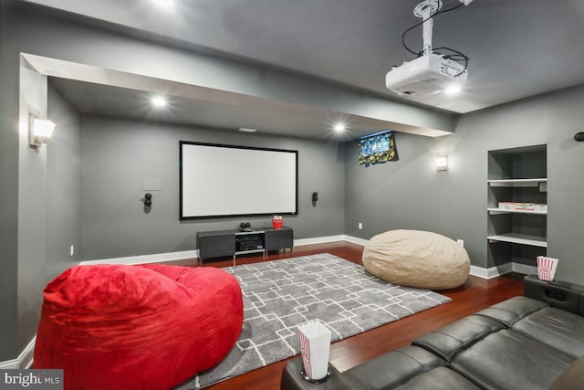 14309 Cervantes Ave, Darnestown, MD 20874 - cinema room with baseboards, built in features, and wood finished floors