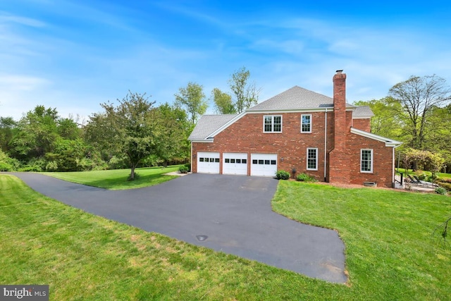 14309 Cervantes Ave, Darnestown, MD 20874 - view of side of property featuring roof with shingles, brick siding, a chimney, a yard, and driveway