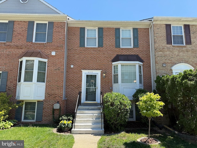 multi unit property featuring brick siding