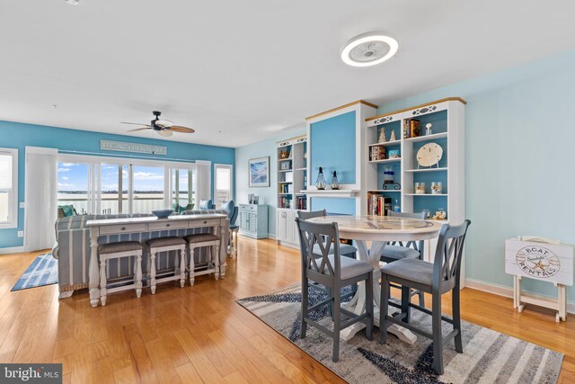 17598 Paleo Way Unit 9, Millsboro, DE 19966 - dining space featuring ceiling fan, light wood finished floors, and baseboards