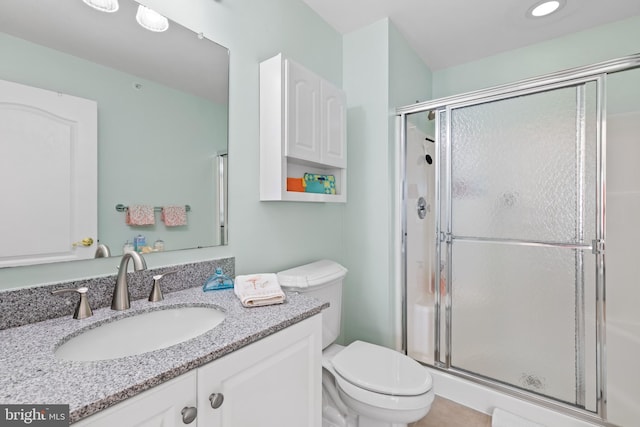 17598 Paleo Way Unit 9, Millsboro, DE 19966 - bathroom with a shower stall, toilet, and vanity