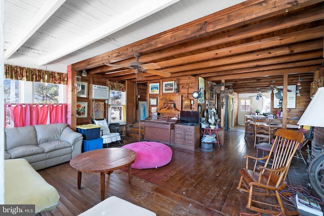 living room featuring beam ceiling, a ceiling fan, and hardwood / wood-style floors