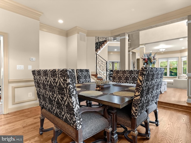 6 Jarretts Ct, Reisterstown, MD 21136 - dining room featuring wood finished floors, stairway, ornate columns, wainscoting, and ornamental molding