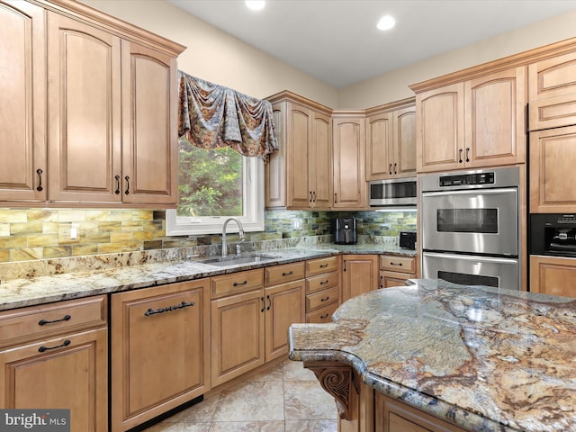 6 Jarretts Ct, Reisterstown, MD 21136 - kitchen featuring stainless steel appliances, light stone counters, tasteful backsplash, recessed lighting, and light brown cabinets