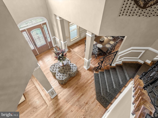 6 Jarretts Ct, Reisterstown, MD 21136 - foyer entrance with decorative columns, a towering ceiling, wood finished floors, healthy amount of natural light, and stairway