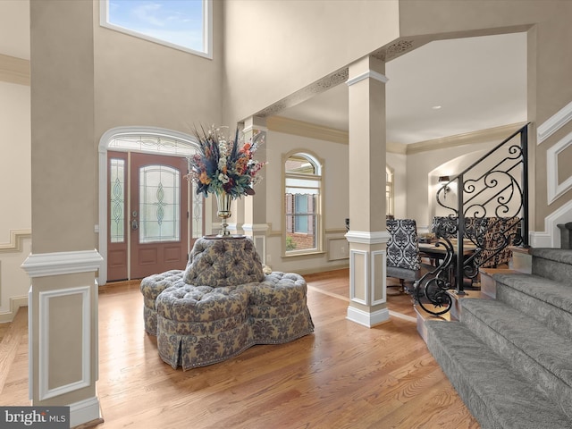 6 Jarretts Ct, Reisterstown, MD 21136 - entryway with decorative columns, healthy amount of natural light, stairway, light wood finished floors, and a high ceiling