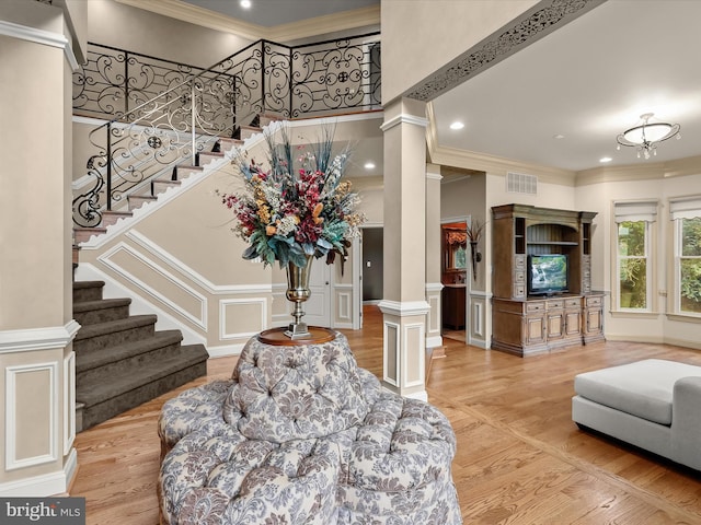 6 Jarretts Ct, Reisterstown, MD 21136 - living room featuring ornate columns, wood finished floors, stairway, crown molding, and a high ceiling
