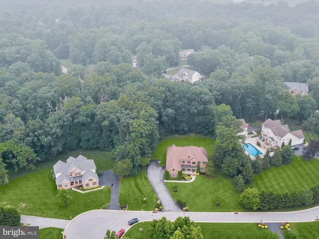 6 Jarretts Ct, Reisterstown, MD 21136 - drone / aerial view of a pool area and a heavily wooded area