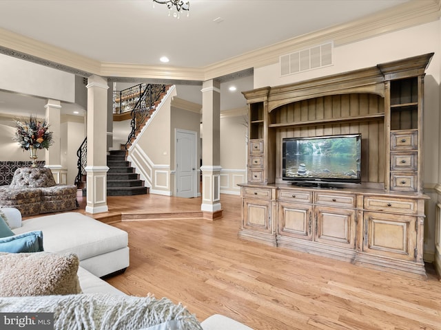 6 Jarretts Ct, Reisterstown, MD 21136 - living room with ornate columns, ornamental molding, light wood finished floors, a decorative wall, and stairs