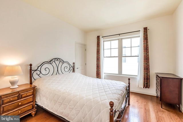 bedroom featuring wood finished floors