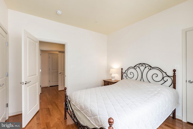 bedroom with wood finished floors