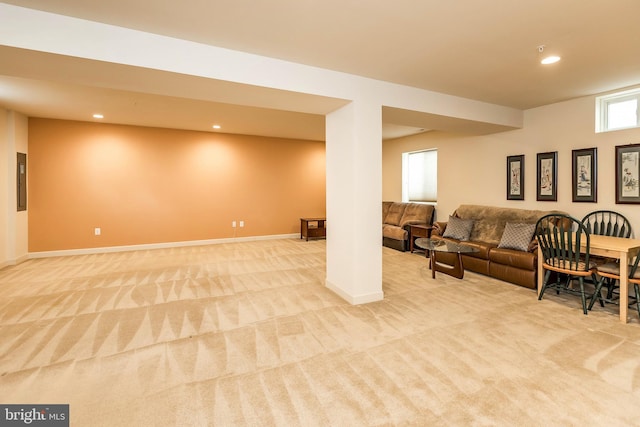 living room featuring light colored carpet, baseboards, and recessed lighting