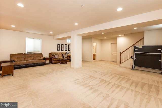 living area with stairs, light carpet, and recessed lighting