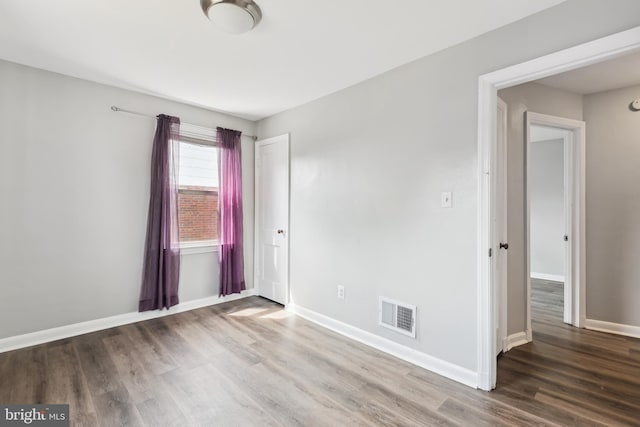 2026 S Oakland St S, Arlington, VA 22204 - unfurnished room with baseboards, visible vents, and wood finished floors