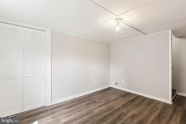 2026 S Oakland St S, Arlington, VA 22204 - unfurnished bedroom with baseboards, dark wood-style flooring, a closet, and visible vents