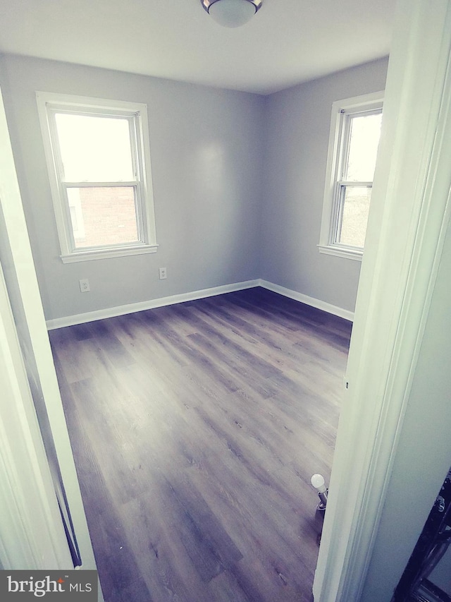 2026 S Oakland St S, Arlington, VA 22204 - empty room featuring baseboards and wood finished floors