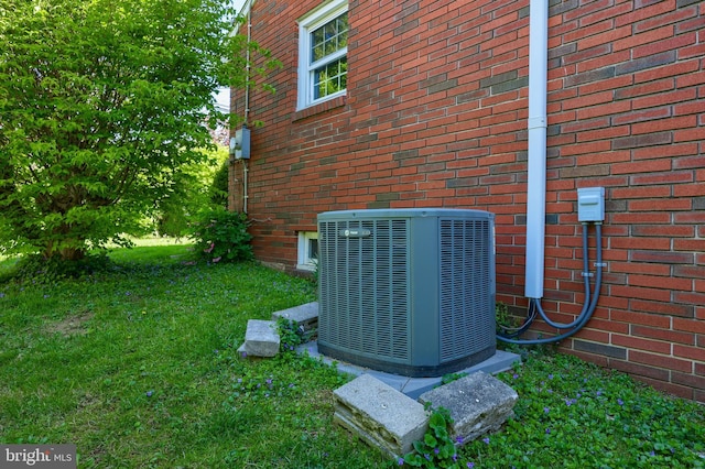 details with central AC unit and brick siding