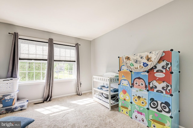 bedroom featuring baseboards and carpet