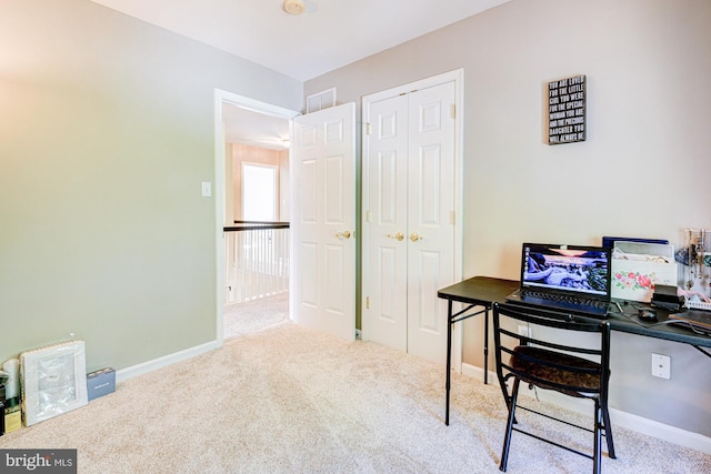 carpeted home office with baseboards and visible vents