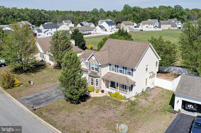 birds eye view of property with a residential view