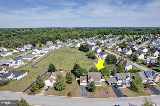 birds eye view of property with a residential view and a forest view