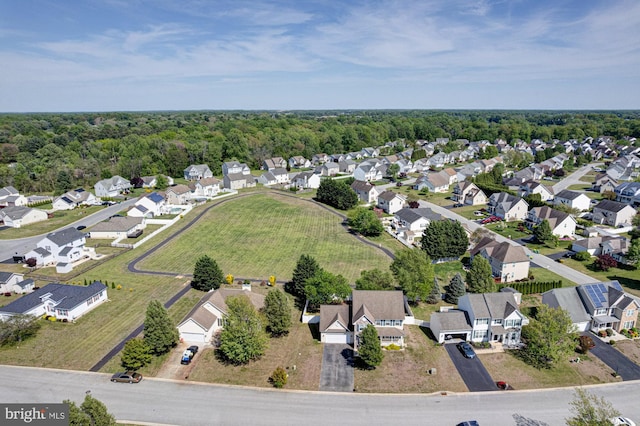 bird's eye view with a residential view and a wooded view