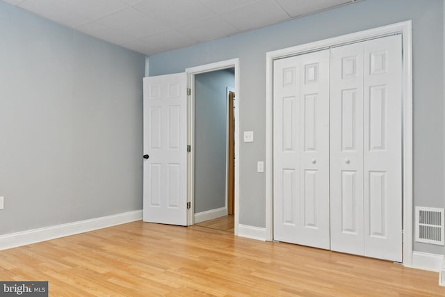 4018 Pennington Ave, Baltimore City, MD 21226 - unfurnished bedroom with a closet, baseboards, visible vents, and light wood-style floors