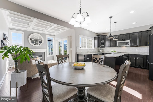 1524 Kinnaird Ter NE, Leesburg, VA 20176 - dining room with an inviting chandelier, a wealth of natural light, dark wood-type flooring, and coffered ceiling