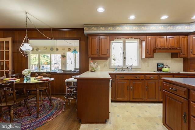 5983 Labs Run Ln, Penn Laird, VA 22846 - kitchen featuring brown cabinetry, a peninsula, and white cooktop