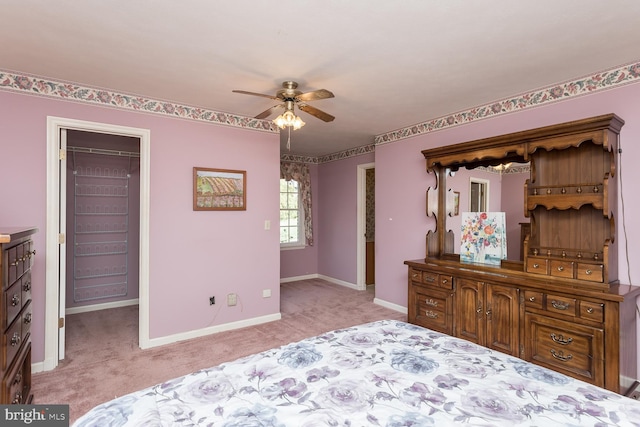 5983 Labs Run Ln, Penn Laird, VA 22846 - bedroom featuring a closet, a ceiling fan, baseboards, a walk in closet, and carpet flooring
