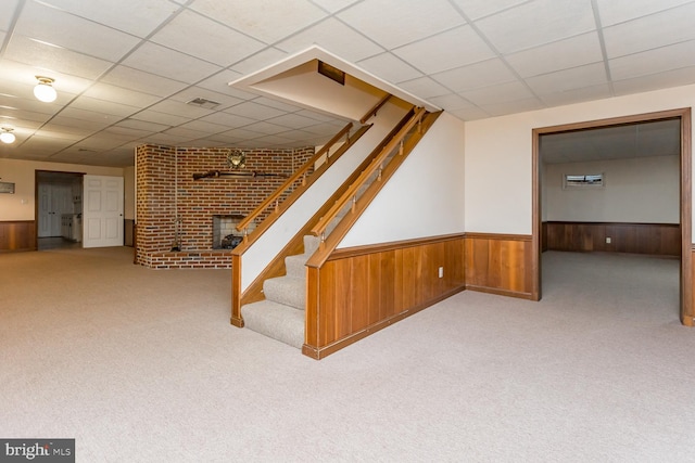 5983 Labs Run Ln, Penn Laird, VA 22846 - finished basement featuring carpet floors, a paneled ceiling, a brick fireplace, and a wainscoted wall