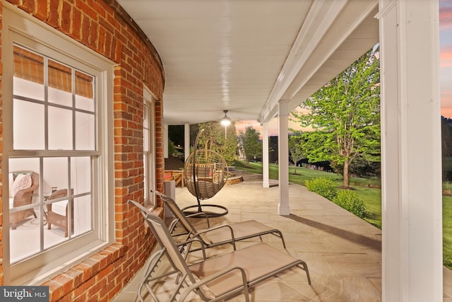 patio terrace at dusk with covered porch