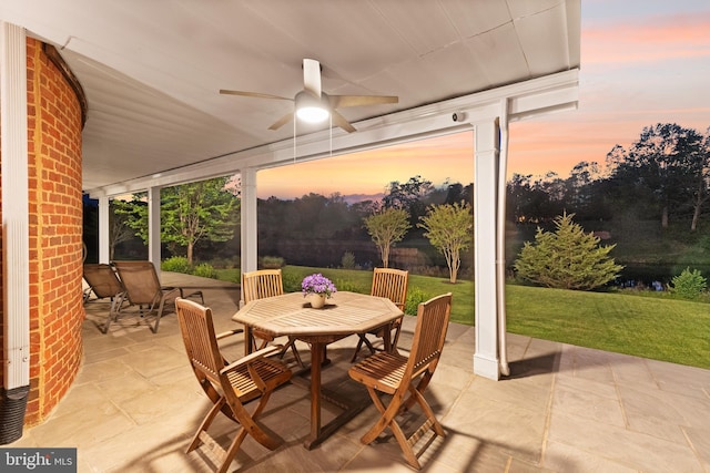 view of patio / terrace featuring a ceiling fan and outdoor dining space