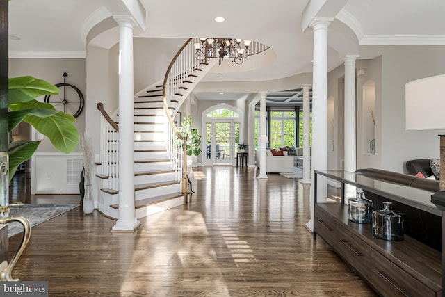 foyer entrance with ornate columns, recessed lighting, stairs, and wood finished floors