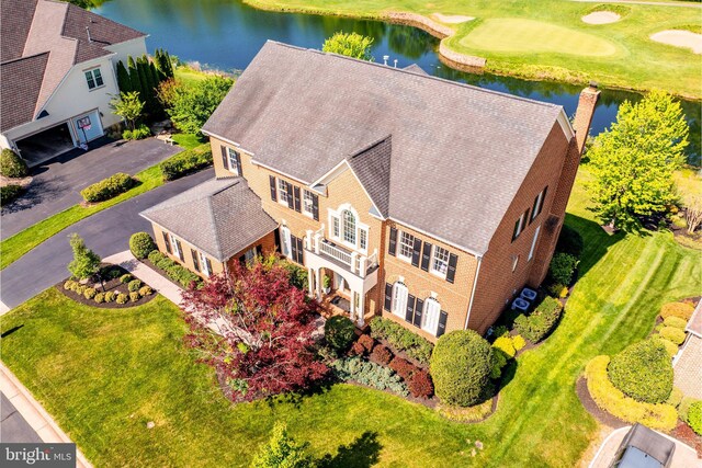 birds eye view of property featuring a water view and golf course view