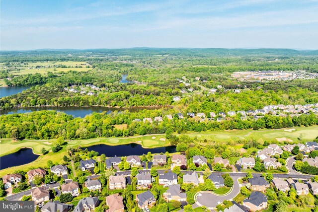 birds eye view of property featuring a residential view, a water view, and golf course view