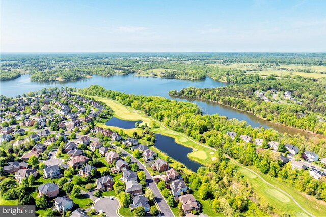 aerial view featuring a residential view, a water view, and golf course view