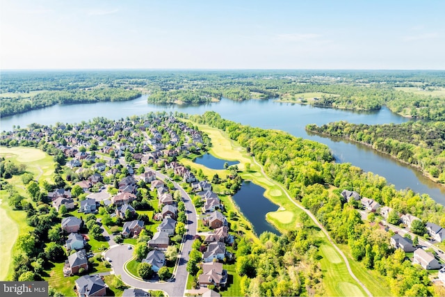 drone / aerial view with a water view, golf course view, and a residential view